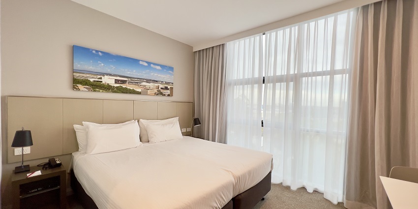 A picture of a hotel room near the Nature Park in Kolkata with all the basic amenities