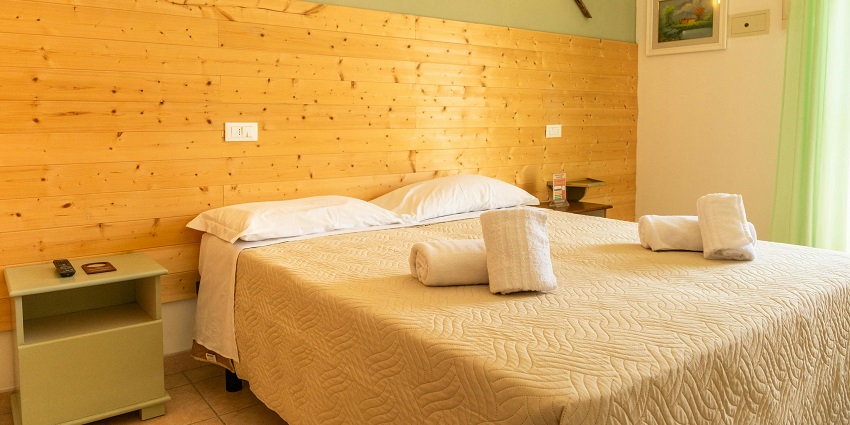 Stately hotel with cosy rooms and warm lighting offering a comfortable stay to visitors.