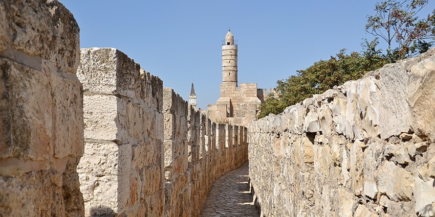 A picture of Yanam Tower that can be seen overlooking the backdrop.