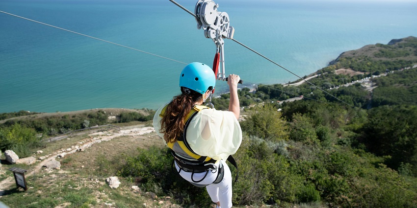 High-speed zipline offering thrilling aerial river views.