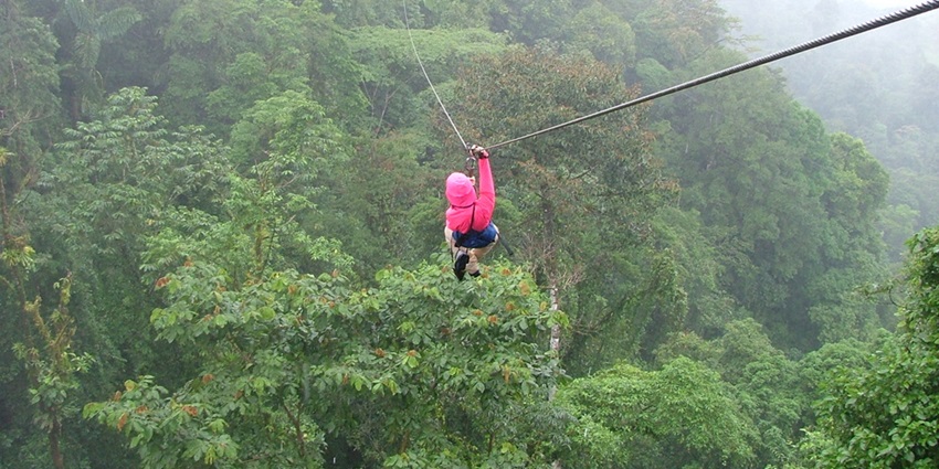 Exciting aerial ride soaring over scenic landscapes and valleys.