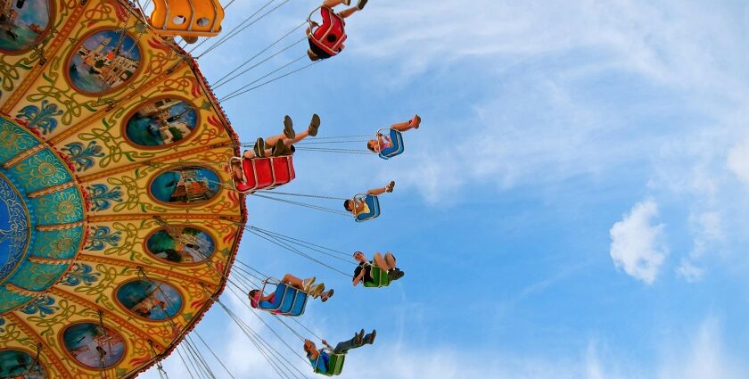 An image of a vibrant blue and orange Ferris wheel at Wonderland Theme Park in Chennai