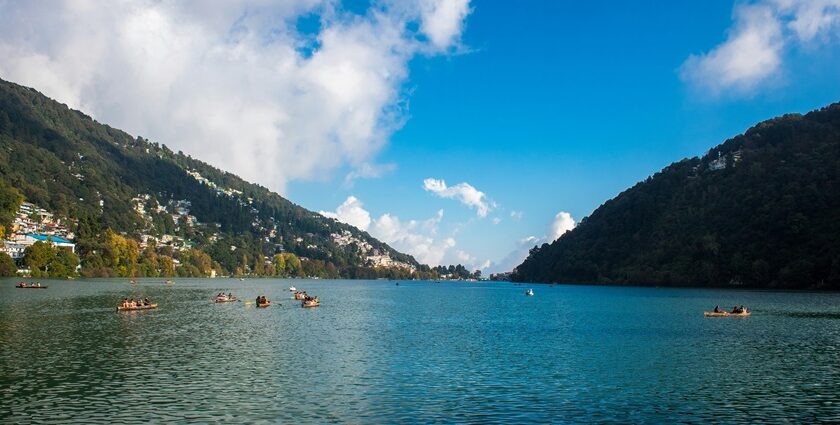 A panoramic view of mist-covered valleys at hill station near Nainital.