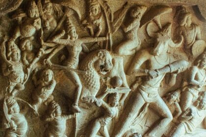 Intricate ancient Indian stone relief sculpture with detailed carvings of figures