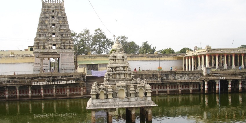 Image of the temple building, showcasing unique architecture with clear blue sky in background