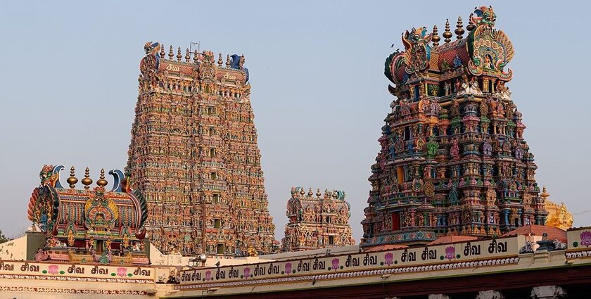 View of the temples of Madurai, India, with buildings and greenery surrounding them.