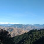 Image of a view of Dehradun peak, showcasing natural beauty, peaceful environment, and tranquillity.