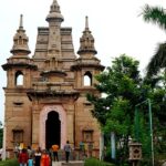 Front view of the Buddhist temple at Sarnath, showcasing its architectural beauty and amazing surroundings.