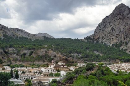 A scenic view of mountains in Malleswaram with a cluster of traditional houses.