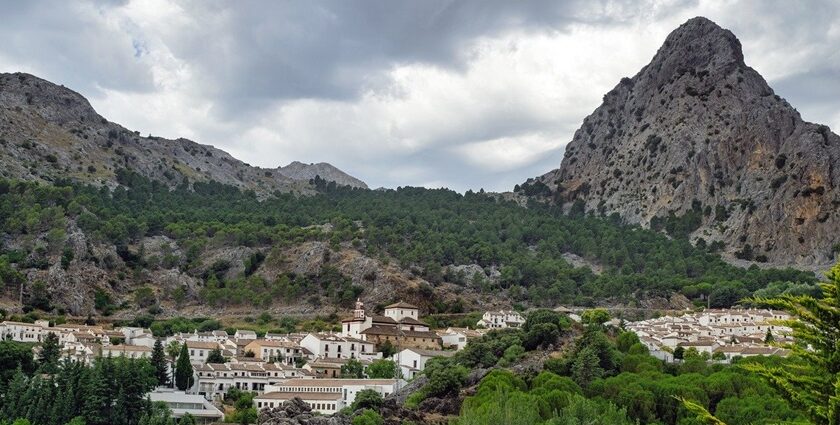 A scenic view of mountains in Malleswaram with a cluster of traditional houses.