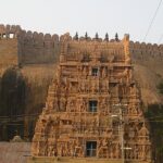 Thirumayam Temple complex, displaying the temple's vibrant gopuram with intricate carvings.