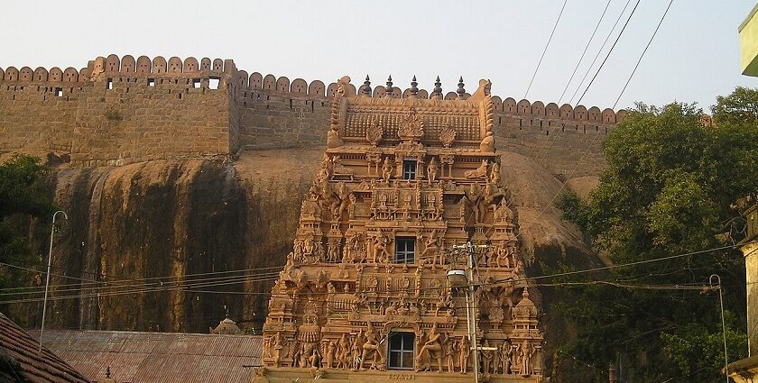 Thirumayam Temple complex, displaying the temple's vibrant gopuram with intricate carvings.