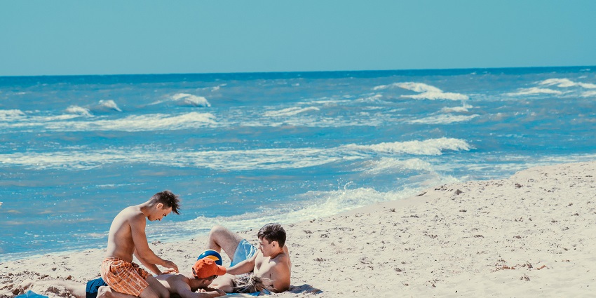 mage showcasing visitors relaxing at a beach similar to the 31st Street Beach, Chicago.