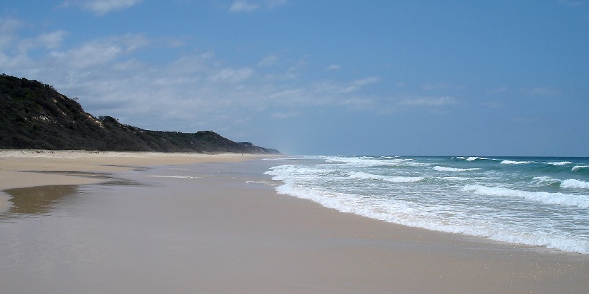 An aerial view of 75 Mile Beach, a vast expanse of golden sand doubles as a scenic highway.