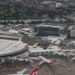 An aerial view of Sydney Airport, among the airports in Australia and busy travel hubs.