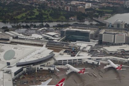 An aerial view of Sydney Airport, among the airports in Australia and busy travel hubs.