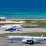 A view of American Airlines aircraft on the runway preparing for departure in Montego Bay.