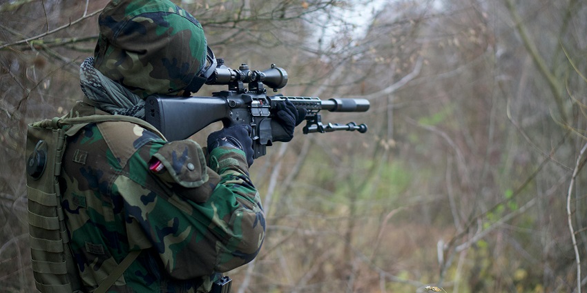 An image of the players in tactical gear participating in an airsoft combat match.
