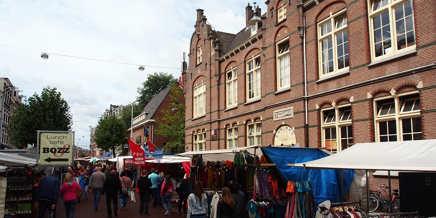 Bustling street market offering fresh produce, street food, and goods.