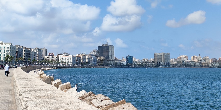 A picture of a corniche in the city of Alexandria with views of its magnificent skyline