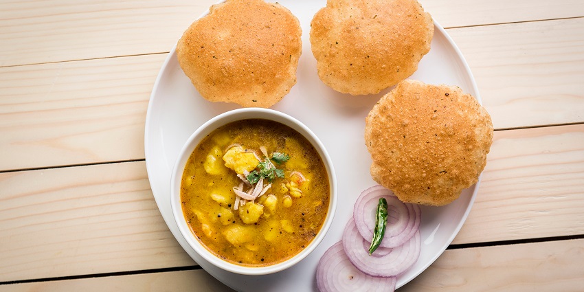 Soft puris accompanied by a flavorful spiced potato dish, delightful.