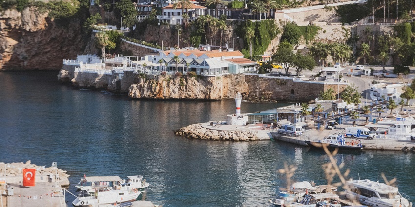 Bustling harbor with luxury yachts, restaurants, and stunning sea views in turkey.