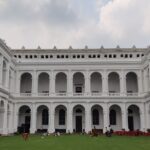 An image of the Art museum Kolkata showcasing vibrant photographic art in a spacious gallery