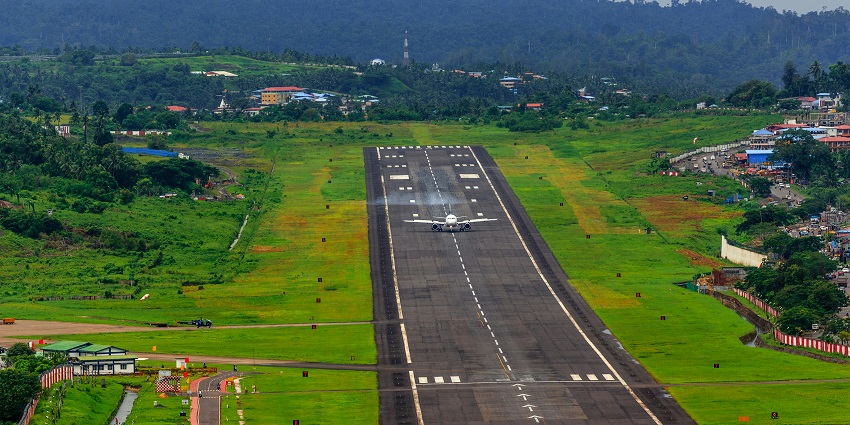 Athens International Airport from the top with a big parking lot and an aeroplane runway