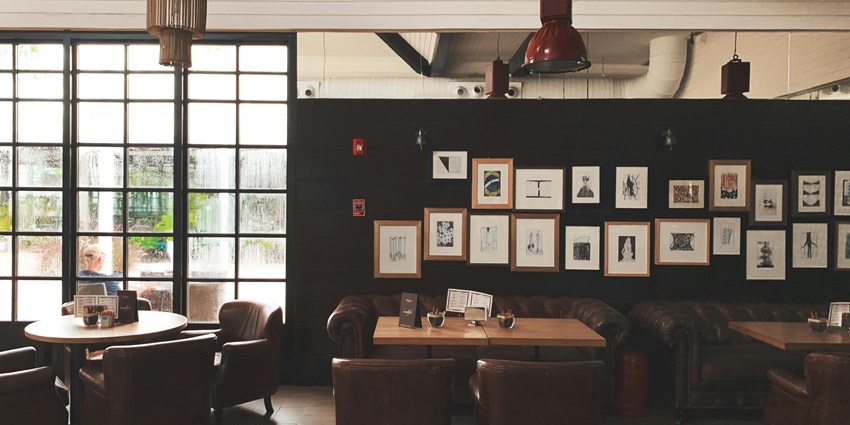 Visit this cosy coffee shop interior with warm lighting, a wooden counter, one of the best things to do in Park Street Kolkata.