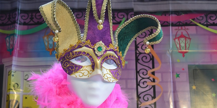 People dressed in clown attires celebrate the Mardi Gras festival in New Orleans