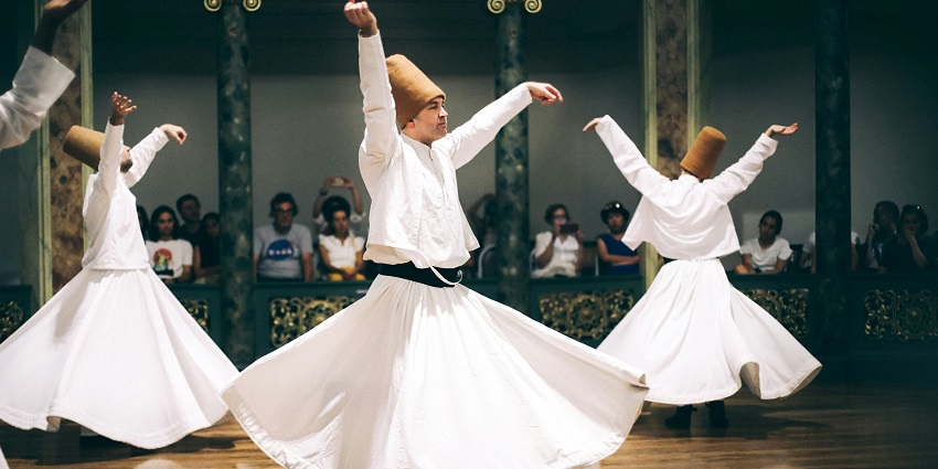 A glimpse of spiritual Sufi dance performance symbolizing divine love and devotion.