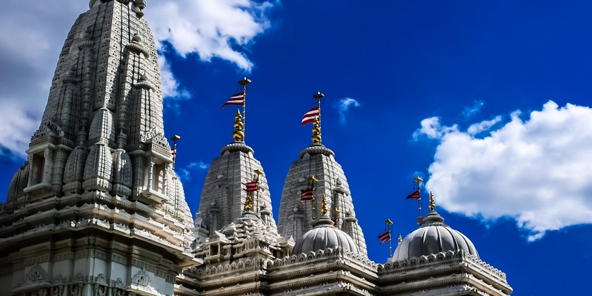 A view of the sacred BAPS Shri Swaminarayan Mandir with intricate architectural details.