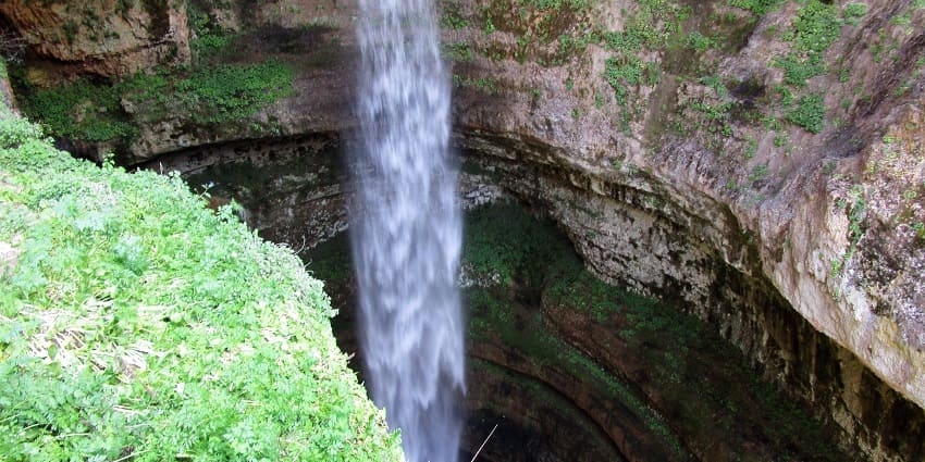 Baatara waterfall is among the best places to visit in Lebanon, plunging through a three-tiered limestone cave.