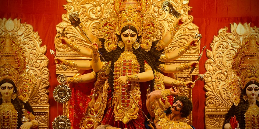 A statue of Goddess Durga, designed with multiple arms, symbolizing strength and divinity.