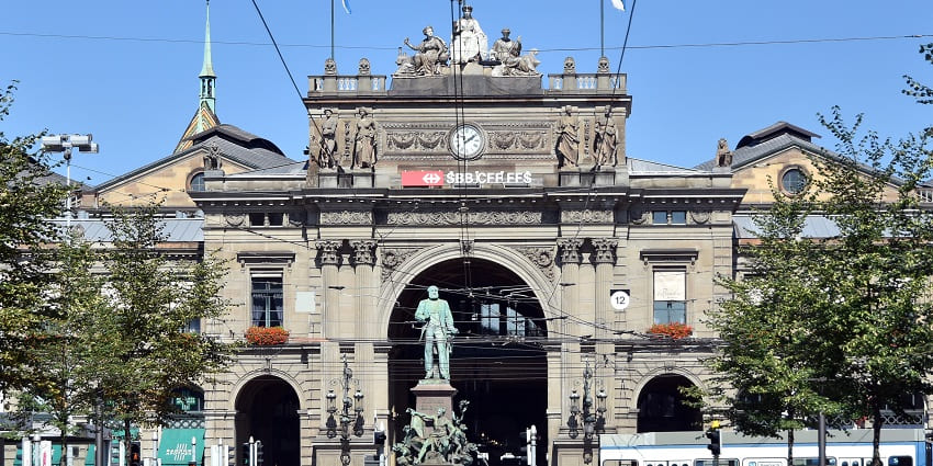 Luxury shopping street with boutiques, cafes, and vibrant atmosphere.