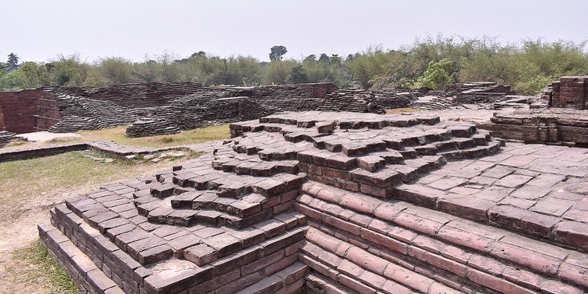 A decorated octagonal structure with a curved roof, identified as Ballal Sen's Dhipi.