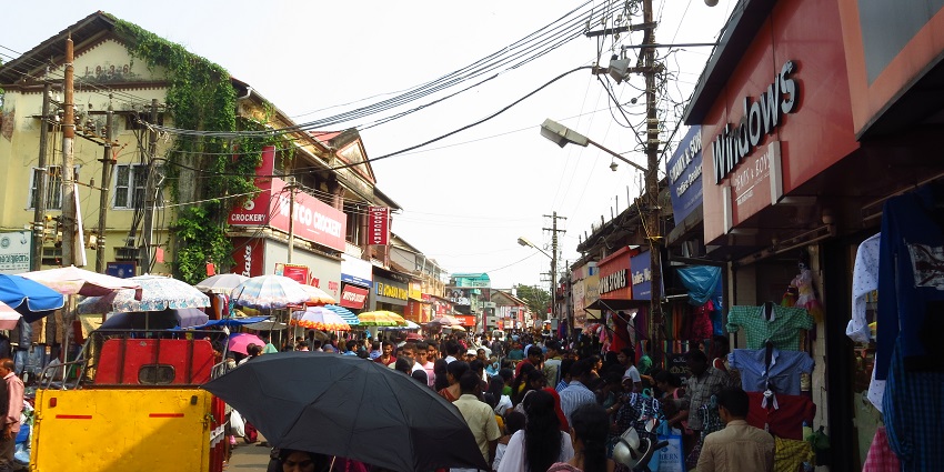 Shopping in Haridwar market with traditional crafts, sweets, and religious items.