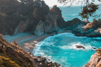 An image of a serene beach, soft sandy shores and natural landscape in Georgia.