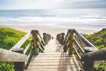 Image of one of the scenic beaches near Toronto with soft sand and clear blue water.