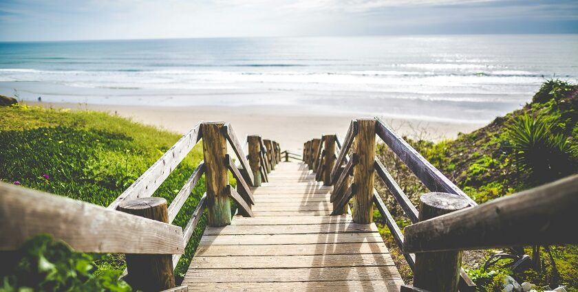 Image of one of the scenic beaches near Toronto with soft sand and clear blue water.