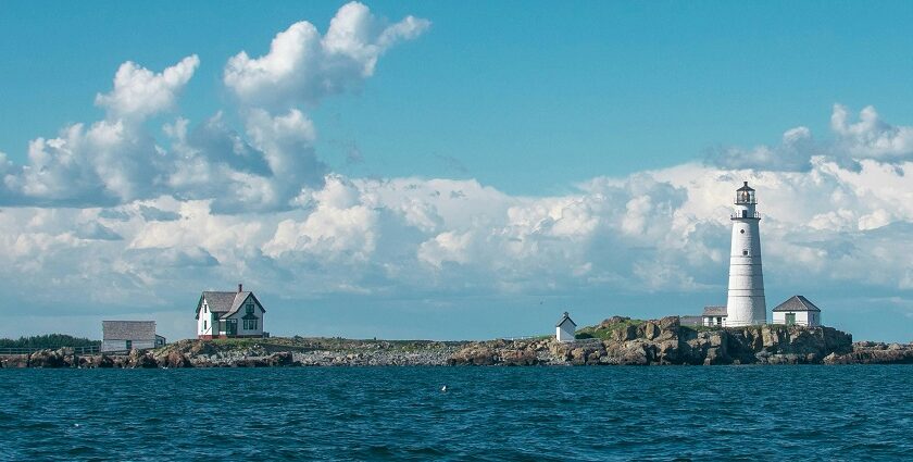 Beach in Boston with a lighthouse, offering scenic views of the shoreline and clear waters