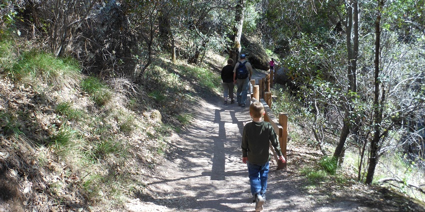  An image of visitors at the Bear Gulch Cave Trail in Pinnacles National Park, California.