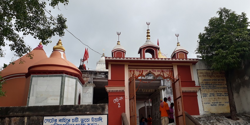 A picture of Bakreshwar Hot Spring with historic temples and natural surroundings.