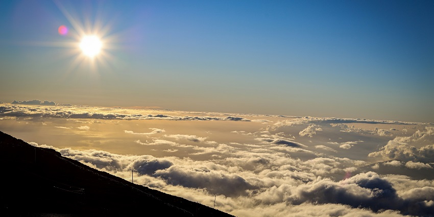 The scenic view of the national park showcases the volcanic landscape and vast sky.