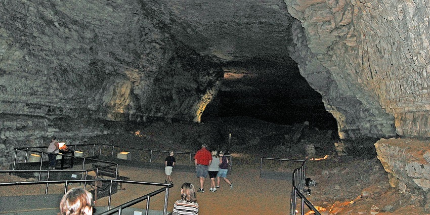 Tourists exploring the underground passage inside Mammoth Cave, Kentucky, USA.