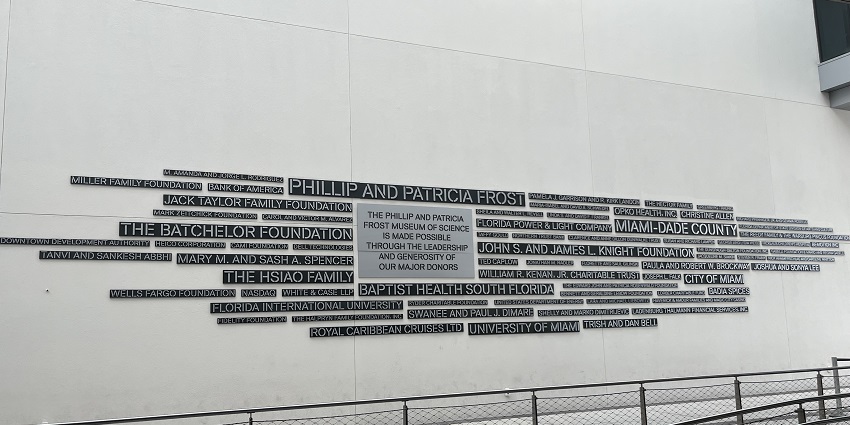 A display of Frost Science Museum exterior with futuristic architecture and glass walls.