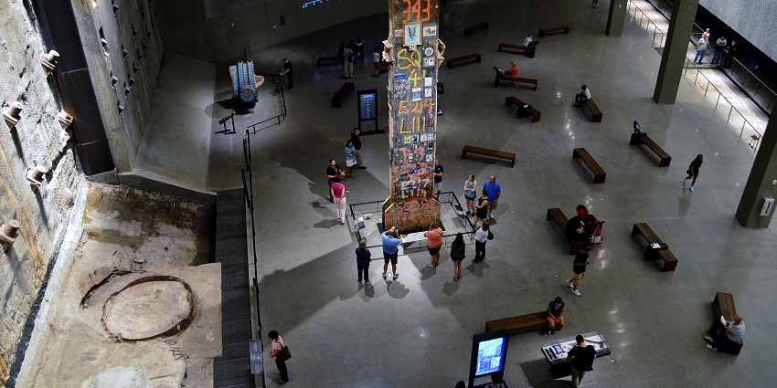 Interior view of the 9/11 Memorial Museum showing a steel beam covered in memorial messages