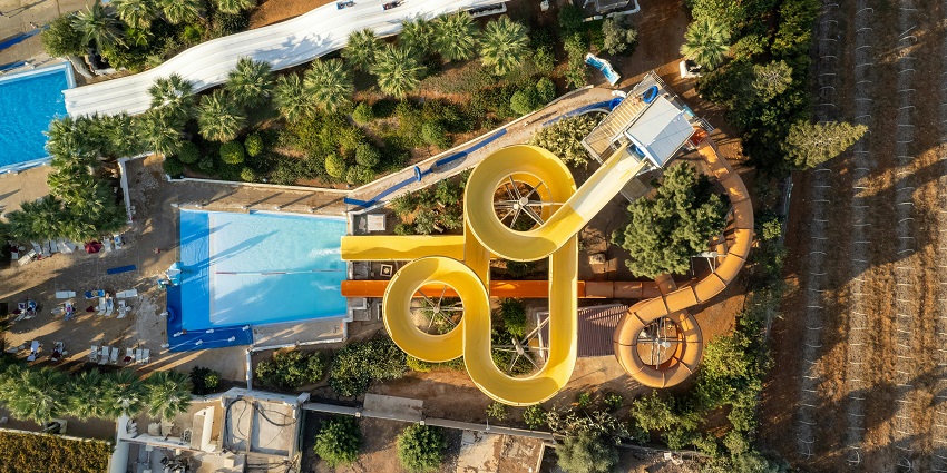 An image of a water park on a sunny day where you can also enjoy water rides