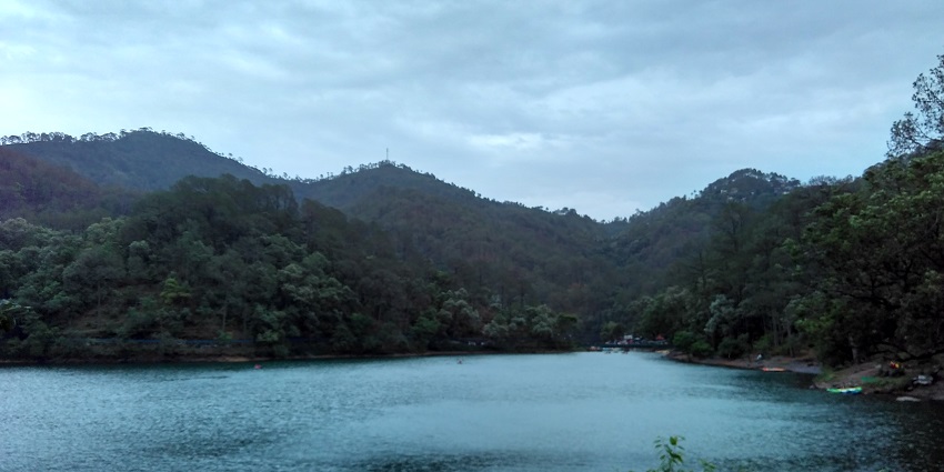 A picture of Bhimtal Lake and surrounding hills, a scenic hill station near Vrindavan.