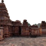 Image of a temple with historical significance architecture surrounded by lush greenery - Bhootnath temple